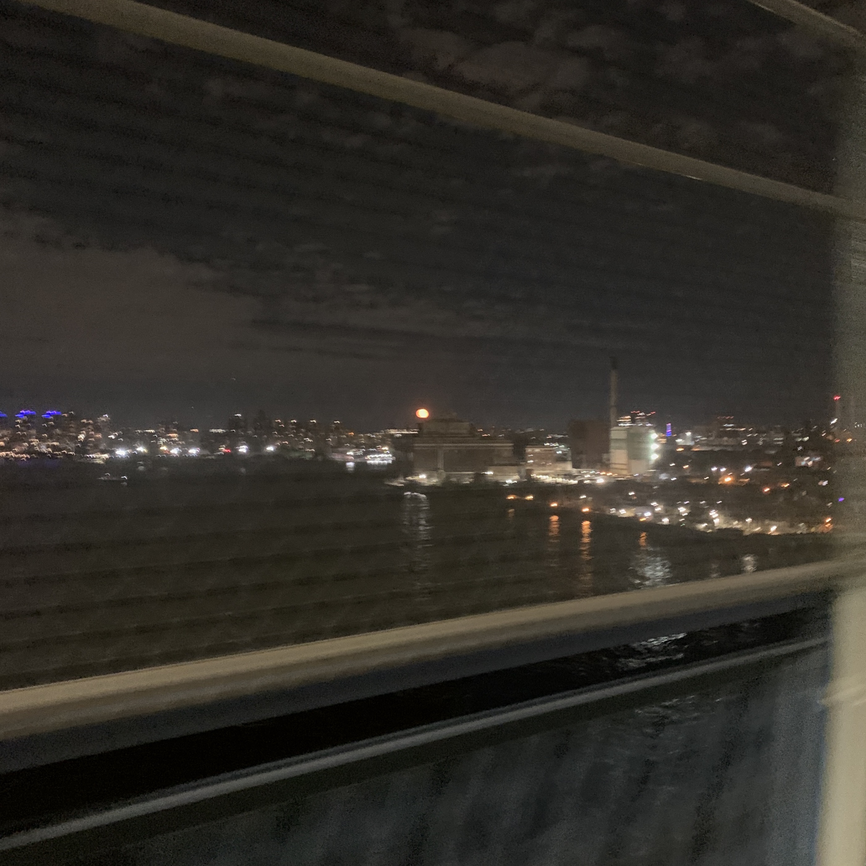 photo of the moon biking over the manhattan bridge